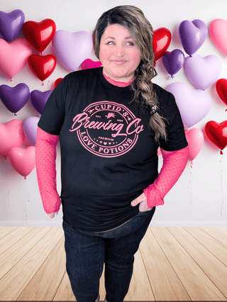 6- Graphic Tops Cupid's Potion Brewing Tee on Black plus size clothing